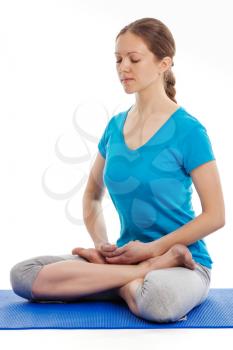 Yoga - young beautiful woman yoga instructor doing Lotus Position (padmasana with bhairava mudra) asana exercise - cross-legged sitting asana for meditation - isolated on white background