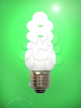Energy save lamp taken closeup on green background.