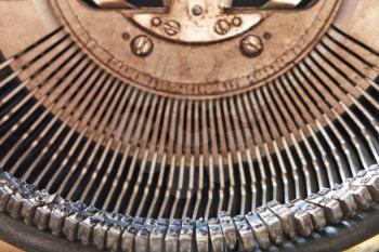 Symbol and mechanism of old typewriter taken closeup.