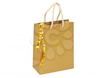 Golden gift bag with decorative golden tape isolated on a white background.