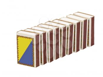 Several matchboxes in a row on a white background.