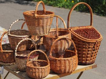 A lot straw basket on table for sale.