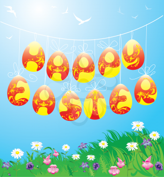 Hanging Easter eggs on spring blue sky background 