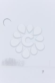 Parachute and Snow Boarding in Blizzard