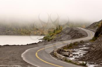 Curving road and low clouds in British Columbia