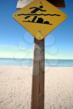 Swimmers warning sign along beach of Lake Winnipeg