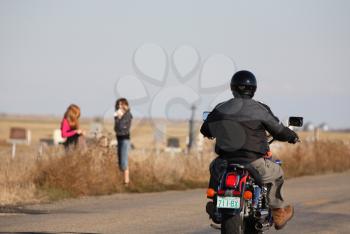 Motorcyclists drving down a Saskatchewan road