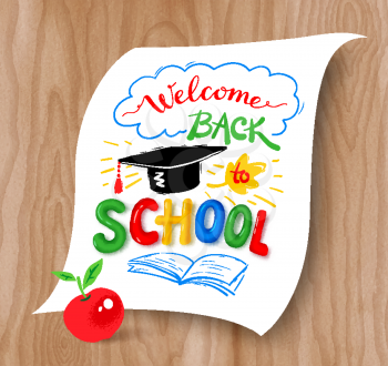 Welcome Back to School lettering with graduation hat and plasticine letters on light wood background.