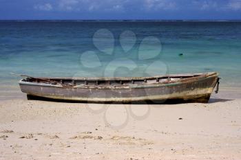 boat and  beach in belle mare mauritius