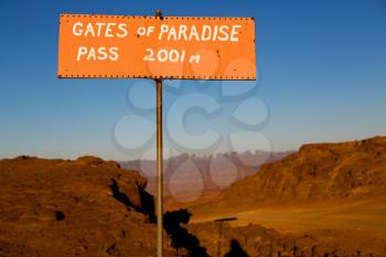 in lesotho road sign gate of paradise pass mountain destination