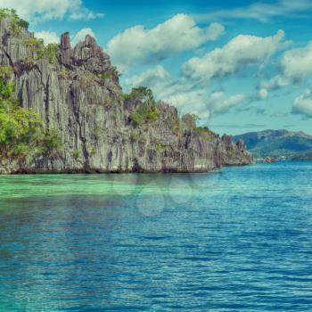 from a boat  in  philippines  snake island near el nido palawan beautiful panorama coastline sea and rock 