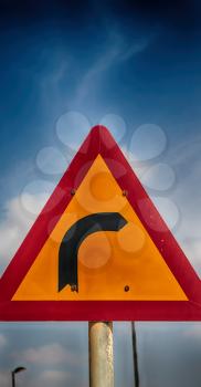 road signal attention of the curve in the sky like abstract background
