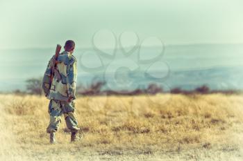 africa  in the land of ethiopia a black soldier  and his gun looking for the border
