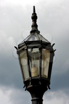 old grey street lamp and clouds in  buenos aires argentina