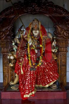 precious stone marble  wood statue of a Hinduism  women  Shiva vishnu Brahma in a temple near a lake in mauritius africa

