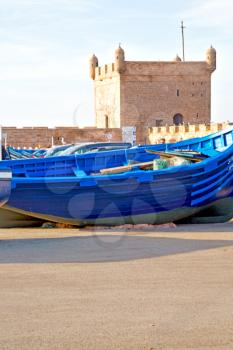   boat and sea      in africa morocco old castle brown brick  sky pier

