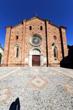 lombardy    in  the castiglione olona   old   church  closed brick tower sidewalk italy 
