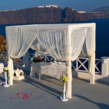 anniversary  and marriage cerimony in the sea of santorini greece island europe