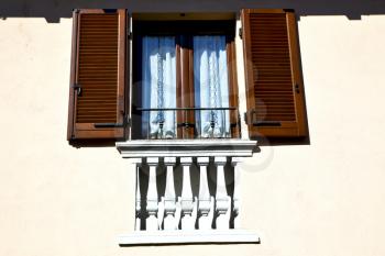 shutter europe  italy  lombardy        in  the milano old   window closed brick      abstract grate  