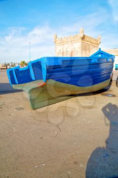   boat and sea      in africa morocco old castle brown brick  sky pier
