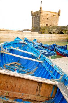   boat and sea in africa morocco old castle brown brick sky
