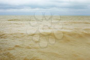 Coastal sea water after the storm contaminated dredged from the seabed sand