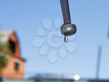 Water drop hanging on the faucet nipples