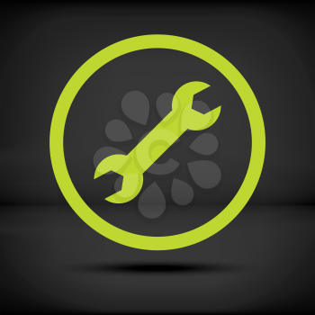 Green repair icon on a black background with shadow