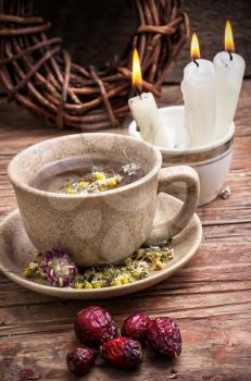 fragrant chamomile tea and briar  in rustic style