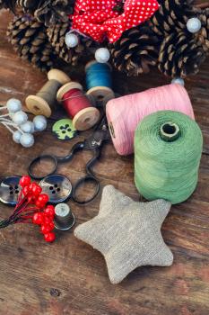 tools of crafts from buttons and thread for the manufacture of Christmas decoration