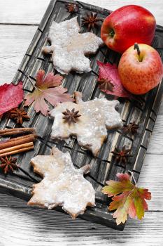 Still life with cookies,fallen leaves and apples