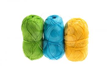 Colored yarn isolated on white background, studio shot, high depth of field