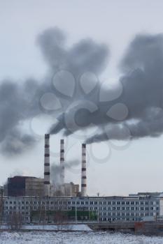 Power plant pollutes the atmosphere, outdoors shot, industrial building