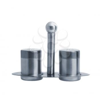 Metal salt and pepper shakers on stand and isolated on white background, studio shot, two objects, front angle