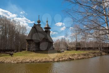 Ancient wooden temple stands on the banks of the river. Kostroma, Russia