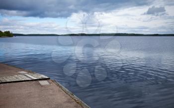 Calm lake harbor in Imatra town, Finland