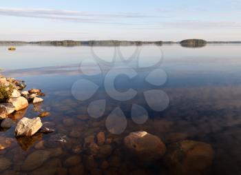 Coast of Saimaa lake with granite stones, Imatra town, Finland