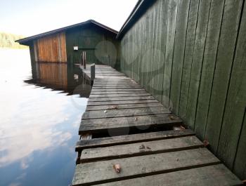 Small old wooden boat garage on Saimaa lake, typically construction for Finland