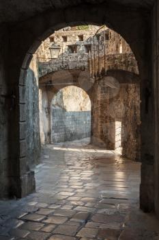 Empty old street fragment with arches. Kotor town, Montenegro