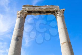 Two columns and portico fragment on blue sky background, ruined roman temple in Smyrna. Izmir, Turkey