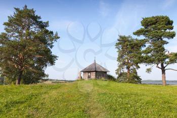 Ancient Orthodox chapel and stone cross on Savkina gorka, Pskov Region, Russia