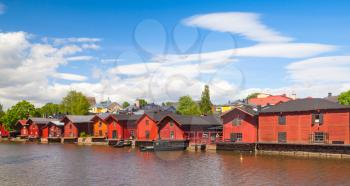 Old red wooden houses on the river coast, Porvoo town, Finland