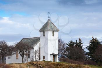 Traditional white wooden Norwegian Lutheran Church in small town