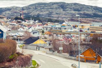 Rorvik, Norwegian town with colorful wooden houses on rocky hills