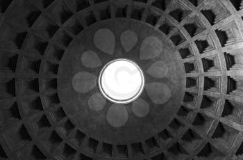 Rome, Italy - August 8, 2015: Inner vault of the dome. Pantheon, one of the best-preserved of Ancient Roman buildings in Rome, Italy. Monochrome photo