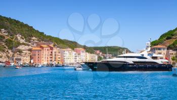 Bonifacio port with moored yachts, small resort port city of Corsica island in sunny summer day, Corse-du-Sud, France