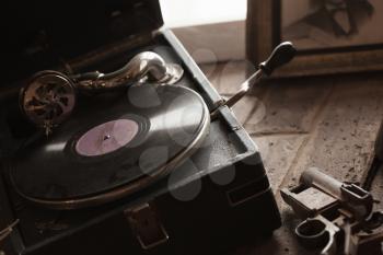 Vintage portable wind-up gramophone, close up photo with selective focus