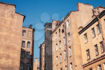 Street fragment with yellow living houses. Saint-Petersburg, Russia