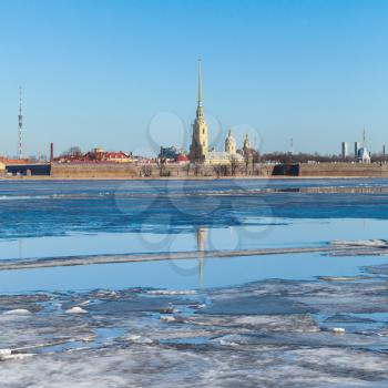 Winter landscape with floating ice on Neva river. Peter and Paul fortress in St. Petersburg, Russia