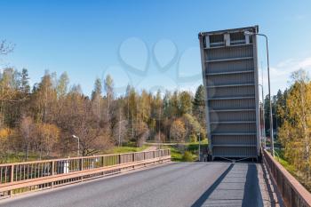 Open drawbridge over Tsvetochnoye lock on the Saimaa Canal, a transportation canal that connects lake Saimaa with the Gulf of Finland near Vyborg, Russia